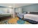 Bedroom featuring three beds, wood floors, and a colorful flower patterned rug at 118 Carter, Walterboro, SC 29488