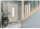 Entryway featuring a white front door, a side table, stairs, and blue-grey walls at 118 Carter, Walterboro, SC 29488