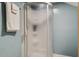 Bathroom featuring a corner shower unit with a frosted glass enclosure and white towels on a rack at 118 Carter, Walterboro, SC 29488