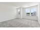 Spacious bedroom offering plush carpet, multiple windows with neighborhood views, and neutral walls at 569 Trotters Ln # 222, Moncks Corner, SC 29461