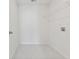 Bright laundry room featuring tile flooring, wire shelving, and hookups ready for your washer and dryer at 569 Trotters Ln # 222, Moncks Corner, SC 29461