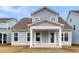Charming backyard with covered porch perfect for outdoor entertaining at 709 Maynard Ln, Summerville, SC 29486