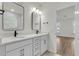 Bathroom with double vanity, modern fixtures, and an adjoining room at 709 Maynard Ln, Summerville, SC 29486