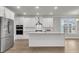 Spacious kitchen featuring white cabinets, a stainless steel refrigerator, and a center island at 709 Maynard Ln, Summerville, SC 29486