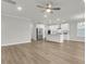 Open-concept kitchen with white cabinetry, stainless steel appliances, and a kitchen island at 709 Maynard Ln, Summerville, SC 29486