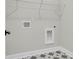 Laundry room with hookups and patterned tile flooring at 709 Maynard Ln, Summerville, SC 29486