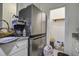 Kitchen features stainless steel refrigerator and granite countertops at 115 Golfview Ln, Summerville, SC 29485