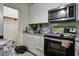 Kitchen with white cabinets, granite counters, and appliances at 115 Golfview Ln, Summerville, SC 29485