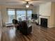 Living room featuring hardwood floors, fireplace, and ample natural light at 115 Golfview Ln, Summerville, SC 29485