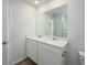 Elegant bathroom with double vanity, large mirror, and wood-look flooring at 204 West Bradford Pointe Dr, Summerville, SC 29486