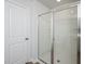 Bathroom featuring glass-enclosed shower stall, tile flooring, and white door at 204 West Bradford Pointe Dr, Summerville, SC 29486