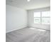 This bright bedroom offers plush carpet, two windows, and neutral walls for easy personalization at 204 West Bradford Pointe Dr, Summerville, SC 29486