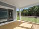 Enjoy outdoor living on this covered back porch with wood flooring and white railings at 319 Calm Water Way, Summerville, SC 29486