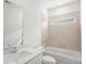Well-lit bathroom featuring a combination bathtub and shower and neutral-toned tile at 319 Calm Water Way, Summerville, SC 29486