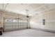Spacious two car garage with concrete floors and an automatic garage door at 319 Calm Water Way, Summerville, SC 29486