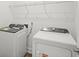 A convenient laundry room includes a washer and dryer with wire shelving for storage at 319 Calm Water Way, Summerville, SC 29486