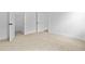 Clean bedroom with neutral carpet, an open closet, and a doorway leading to another room at 323 Trailmore Ln, Summerville, SC 29486