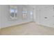 Bright bedroom featuring a closet, two windows for natural light and plush carpeting at 323 Trailmore Ln, Summerville, SC 29486
