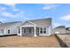 Home featuring a screened in back porch and view of the backyard at 317 Abercom Place Dr, Moncks Corner, SC 29461