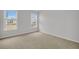 Bright bedroom with neutral carpet, light gray walls, and double windows at 317 Abercom Place Dr, Moncks Corner, SC 29461