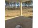 Covered patio overlooking a large backyard surrounded by mature trees at 317 Abercom Place Dr, Moncks Corner, SC 29461