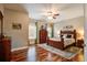 Comfortable bedroom with a wooden bed, a ceiling fan, and hardwood floors at 1129 Plantation Overlook Dr, Moncks Corner, SC 29461