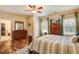 Spacious bedroom with a wooden bed, walk-in closet, and hardwood floors at 1129 Plantation Overlook Dr, Moncks Corner, SC 29461