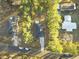 Aerial view of the home showing the driveway, roof, surrounding mature trees, and neighboring homes at 119 Osage Way, Summerville, SC 29483