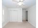 Bedroom featuring neutral carpet, a closet with paneled doors, and window with shutters at 1441 Waterside Ct, Mount Pleasant, SC 29464