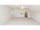 Spacious bedroom with light-colored carpet and a doorway leading to an adjacent space at 1441 Waterside Ct, Mount Pleasant, SC 29464