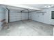 Spacious two car garage with overhead door and storage shelves at 1441 Waterside Ct, Mount Pleasant, SC 29464
