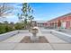 Inviting outdoor area with tables, umbrellas, and well-maintained landscaping at 282 Woodland Oak Way, Summerville, SC 29485