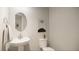 Clean and modern bathroom with pedestal sink and toilet at 104 Elliott Creek Ln, Summerville, SC 29485