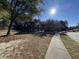 Scenic pond-side walkway in a sunny neighborhood at 104 Elliott Creek Ln, Summerville, SC 29485