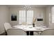 Elegant dining room with a marble table and modern chandelier at 104 Elliott Creek Ln, Summerville, SC 29485