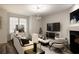 Modern living room featuring comfortable seating and large TV at 104 Elliott Creek Ln, Summerville, SC 29485