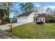 Charming two-story home featuring a two-car garage and well-maintained front yard at 104 Lewisfield Dr, North Charleston, SC 29418
