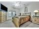 Spacious bedroom with a large bed, dresser, and TV at 127 Manning Ct, Summerville, SC 29485