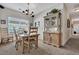 Light-filled dining area with table, chairs, and built-in hutch at 127 Manning Ct, Summerville, SC 29485