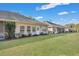 Row of tan houses with screened porches and grassy yard at 127 Manning Ct, Summerville, SC 29485