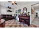 Sunroom features a piano, seating, and checkerboard floor at 127 Manning Ct, Summerville, SC 29485