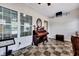 Sunroom with piano, seating area, and glass shelving at 127 Manning Ct, Summerville, SC 29485