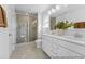 Bright bathroom with double sink vanity, tiled shower, and neutral color palette at 182 Surf Bird St # 639P, Summerville, SC 29486