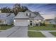 Charming single-Gathering home featuring a manicured lawn, modern exterior and inviting entrance at 373 Whispering Breeze Ln, Summerville, SC 29486