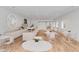 Open interior with clean lines, light wood floors, white walls, and modern tables and chairs creates inviting atmosphere at 278 Meeting St, Charleston, SC 29401