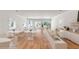 Bright interior showcases light wood floors, white walls, and white tables and chairs for a modern cafe atmosphere at 278 Meeting St, Charleston, SC 29401