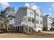 Two-story home with gray siding and deck at 3510 Saltflat Ln, Mount Pleasant, SC 29466