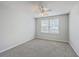 A well-lit bedroom offers neutral carpet and natural light through a window covered with white blinds at 605 Pond Pine Trl, Summerville, SC 29483