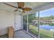 Relaxing screened patio with lake view, fan, and access to outdoor space at 605 Pond Pine Trl, Summerville, SC 29483