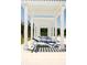 Relaxing poolside lounge area with comfortable seating under a pergola providing shade and style at 773 Opal Wing St, Moncks Corner, SC 29461